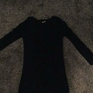 A black long sleeve sweater dress